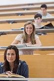 Students sitting looking and smiling