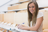 Girl sitting while smiling in the lecture hall