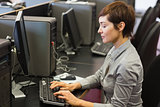 Woman sitting at the computer at the computer room