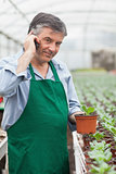 Assistant calling while holding a seedling