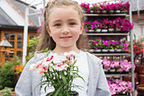 Child holding potted plant
