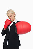 Serious woman with red gloves fighting