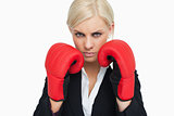 Combative woman with red gloves fighting