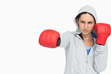 Brunette woman in sweatshirt boxing
