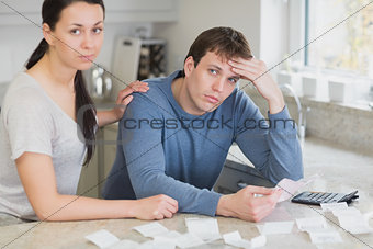 Couple getting stressed over bills