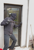 Burglar breaking door
