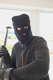 Robber holding a crowbar