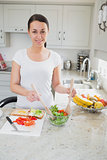 Young woman making healthy lunch
