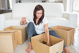 Woman looking into moving boxes