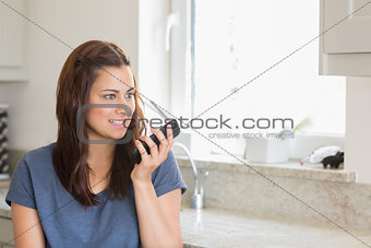 Brunette calling with her smartphone