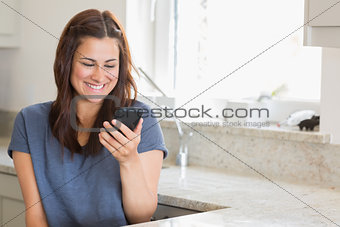 Woman smiling while calling her friend