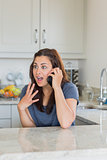 Surprised woman on phone