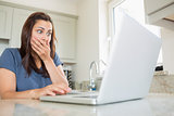 Woman shocked at laptop