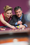 Woman and man placing bets