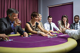 People sitting playing poker