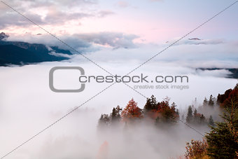 sunrise over fog in Alps