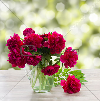 bouquet of peonies on a garden table