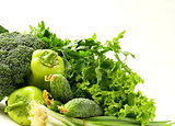 various green vegetables (peppers, broccoli, cucumbers, green onions, lettuce)