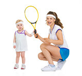 Happy mother and baby holding tennis racket