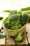 fresh raw green cabbage broccoli in a wicker basket