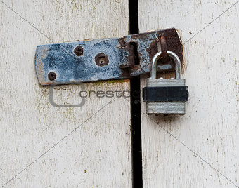 padlock on wooden door