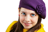 Woman with purple hat and yellow scarf