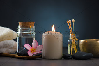 Spa concept in dark background with ambient lights , cold stones