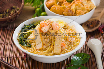 malaysian famous prawn noodle or har mee with decorations on bac