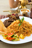 Mutton Biryani rice with traditional items on background