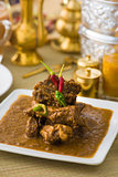 lamb korma famous food with traditional indian background items