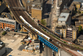 Train on a bridge in London, tilt-shift effect
