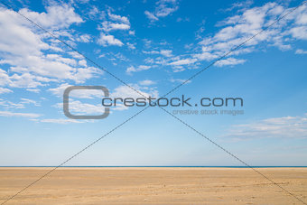 Blue sky and golden sand