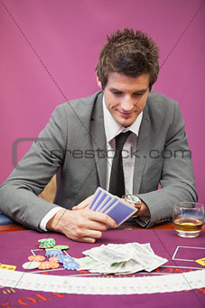 Man playing poker in a casino