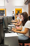 Students sitting at the computer concentrating