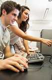 Students looking at something in computer room