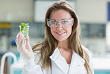 Student standing at the laboratory smiling