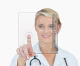 Doctor touching holographic interface