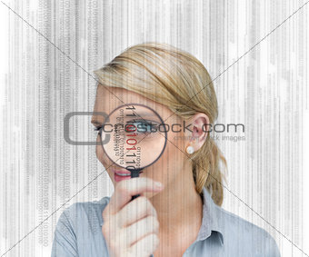 Woman standing holding a magnifying glass