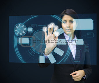 Concentrate woman standing while touching interface