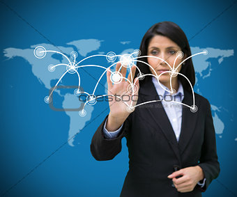Businesswoman pressing on holographic screen with connecting lines
