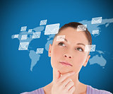 Woman standing while thinking on world map background
