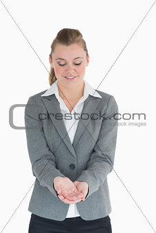 Blonde woman looking at her hands