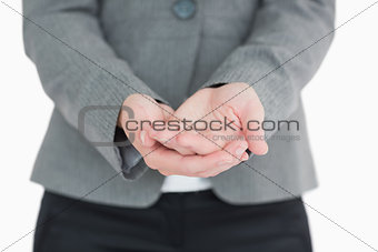 Businesswoman holding out hands