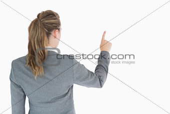 Businesswoman at rear touching on something