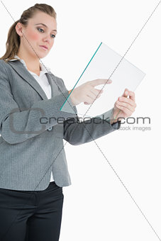 Businesswoman pointing at something on the pane