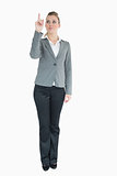 Businesswoman pointing above her