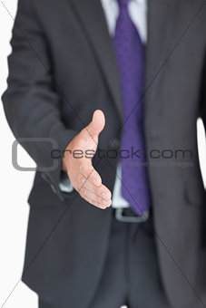 Businessman extending hand