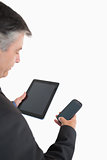 Businessman holding tablet pc and mobile phone