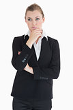 Woman wearing suit and being thoughtful