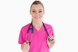 Smiling woman holding her stethoscope